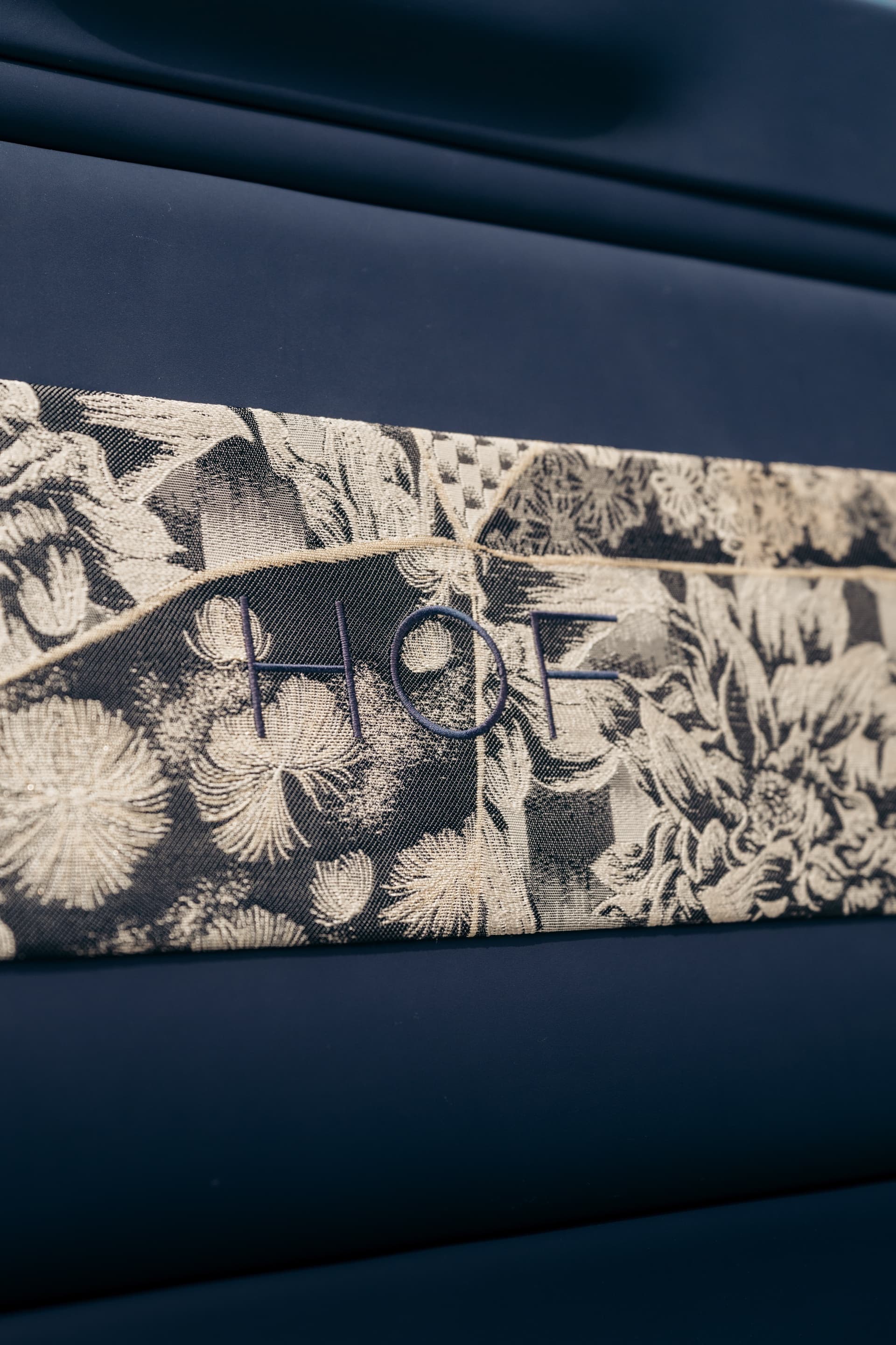 Botanical jacquard with the HOF mark sewn into the weave