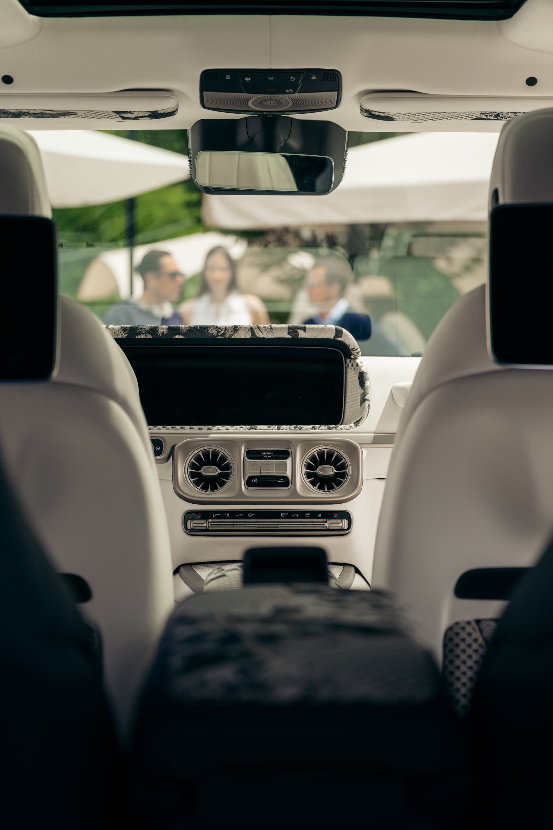 From inside the Kinsō cabin - guests gathered beyond the windshield at Villa del Grumello