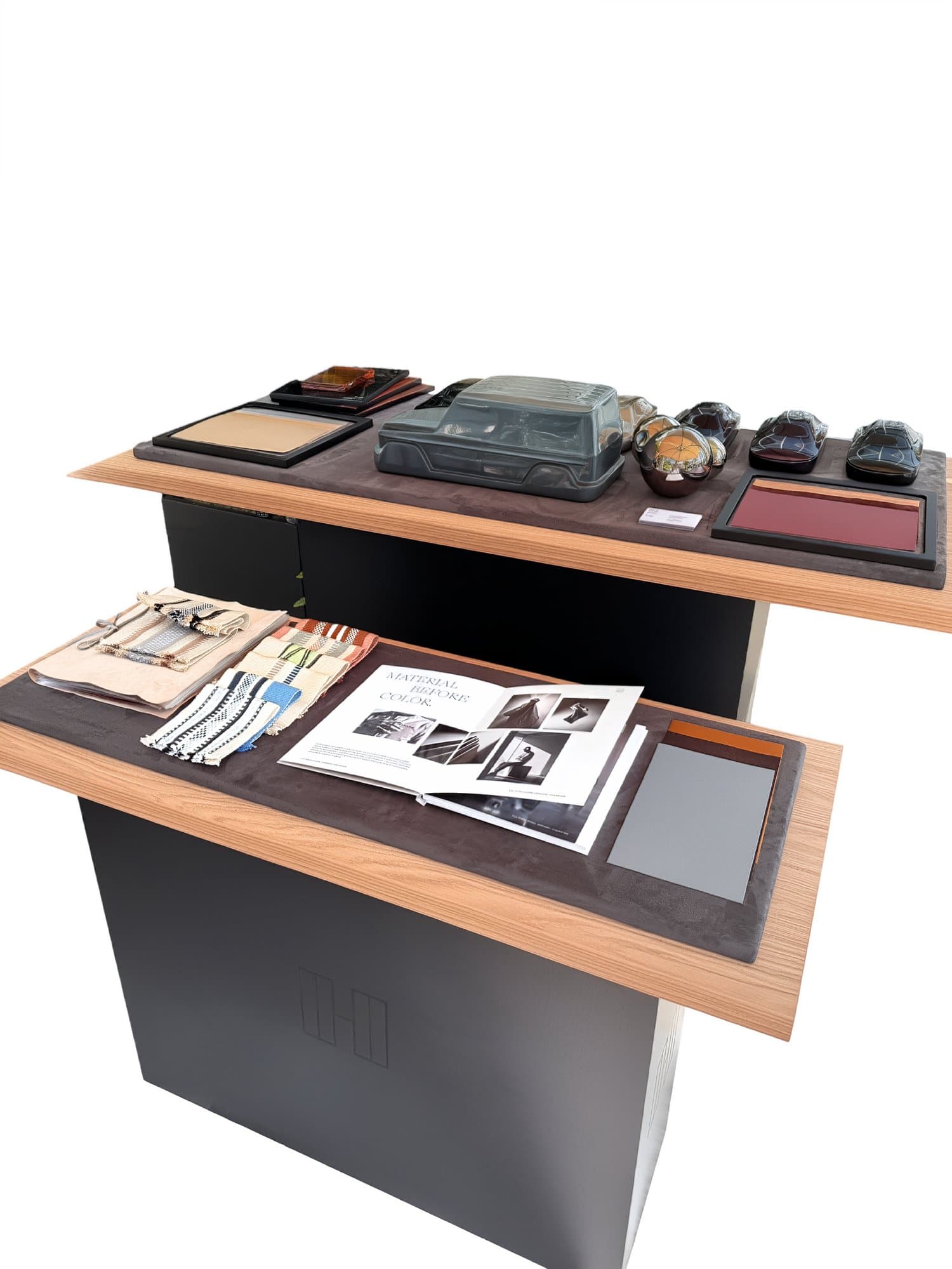 HOF material podium - car sculpture, paint rondels, camel leather panels, hand-loomed swatches and the Material Before Color look-book
